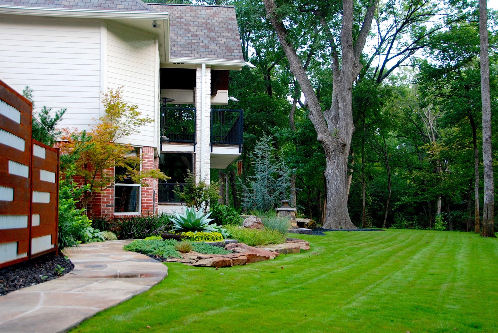Alpine inspired beam stone garden estate landscape in Dallas