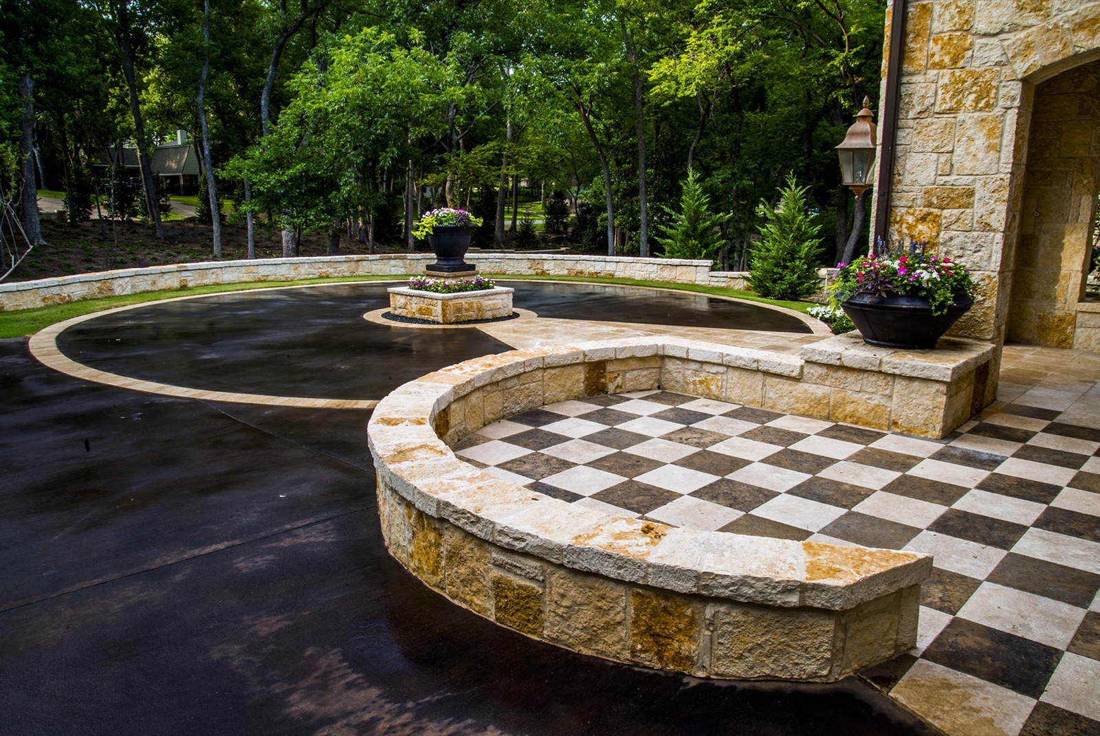 Blanco French Country garden auto court patio in Dallas by landscape design firm