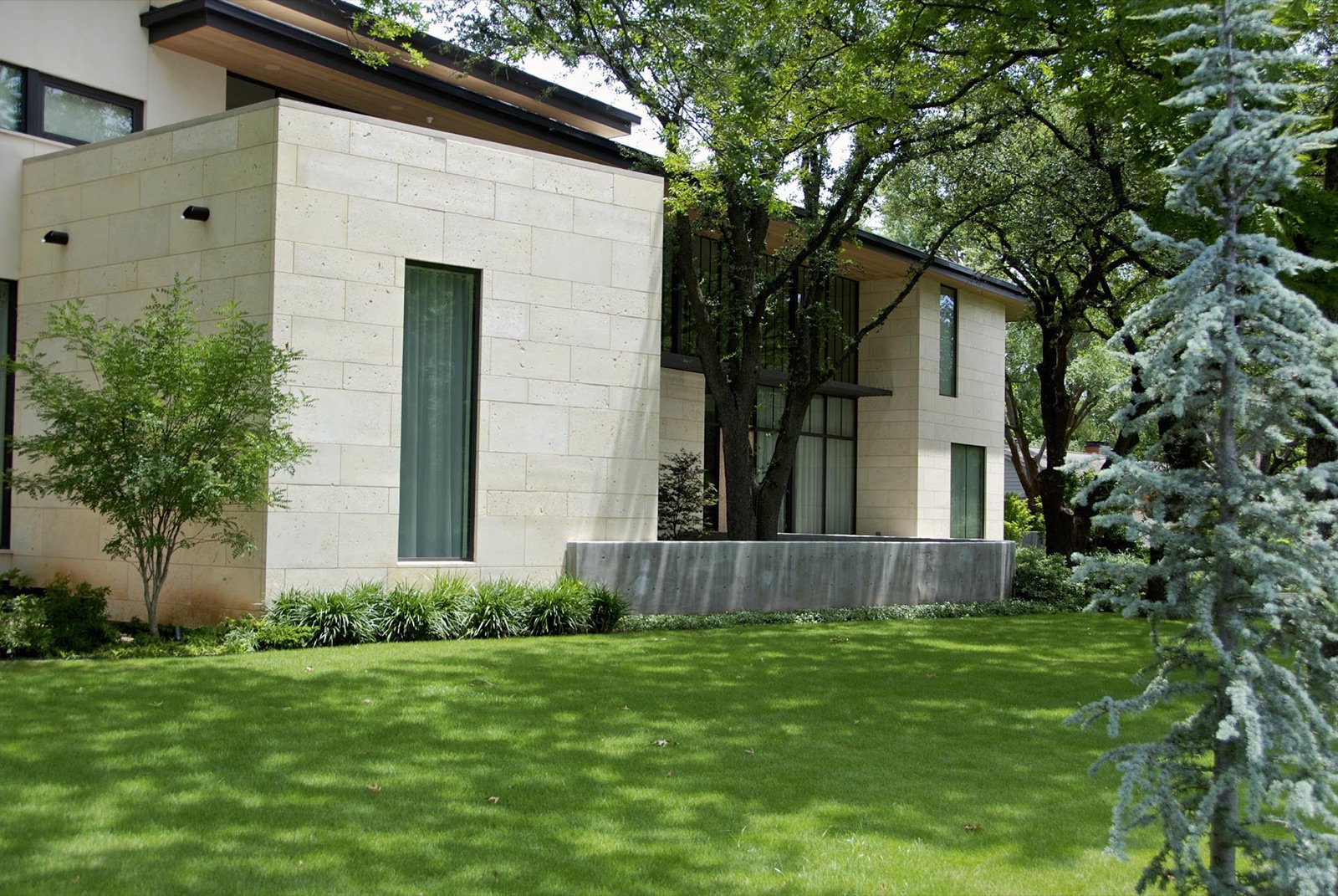 Contemporary estate front yard design in Dallas by residential landscape design firm