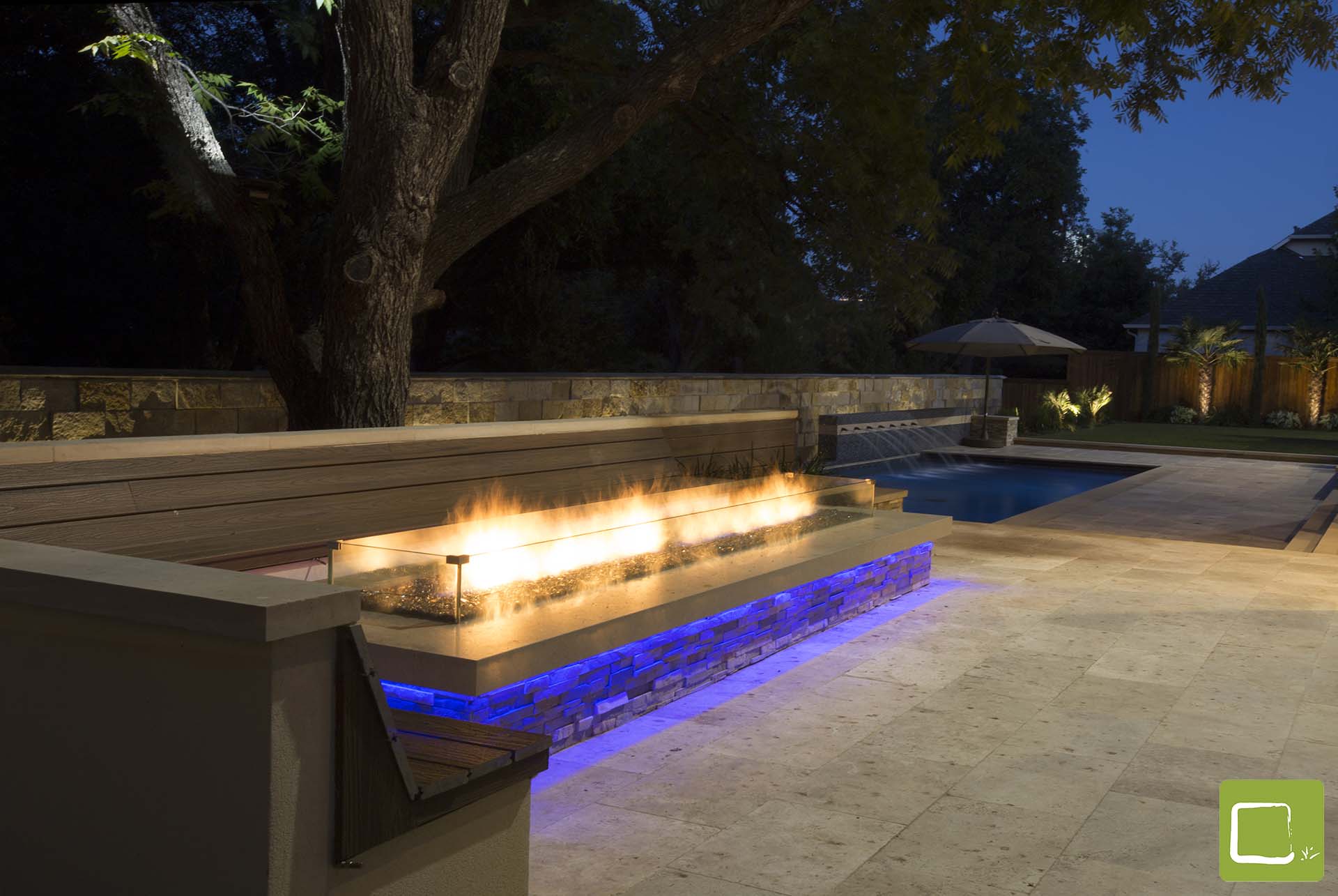 Modern Cantera pool with fire pit outdoor living in Dallas by landscape design firm