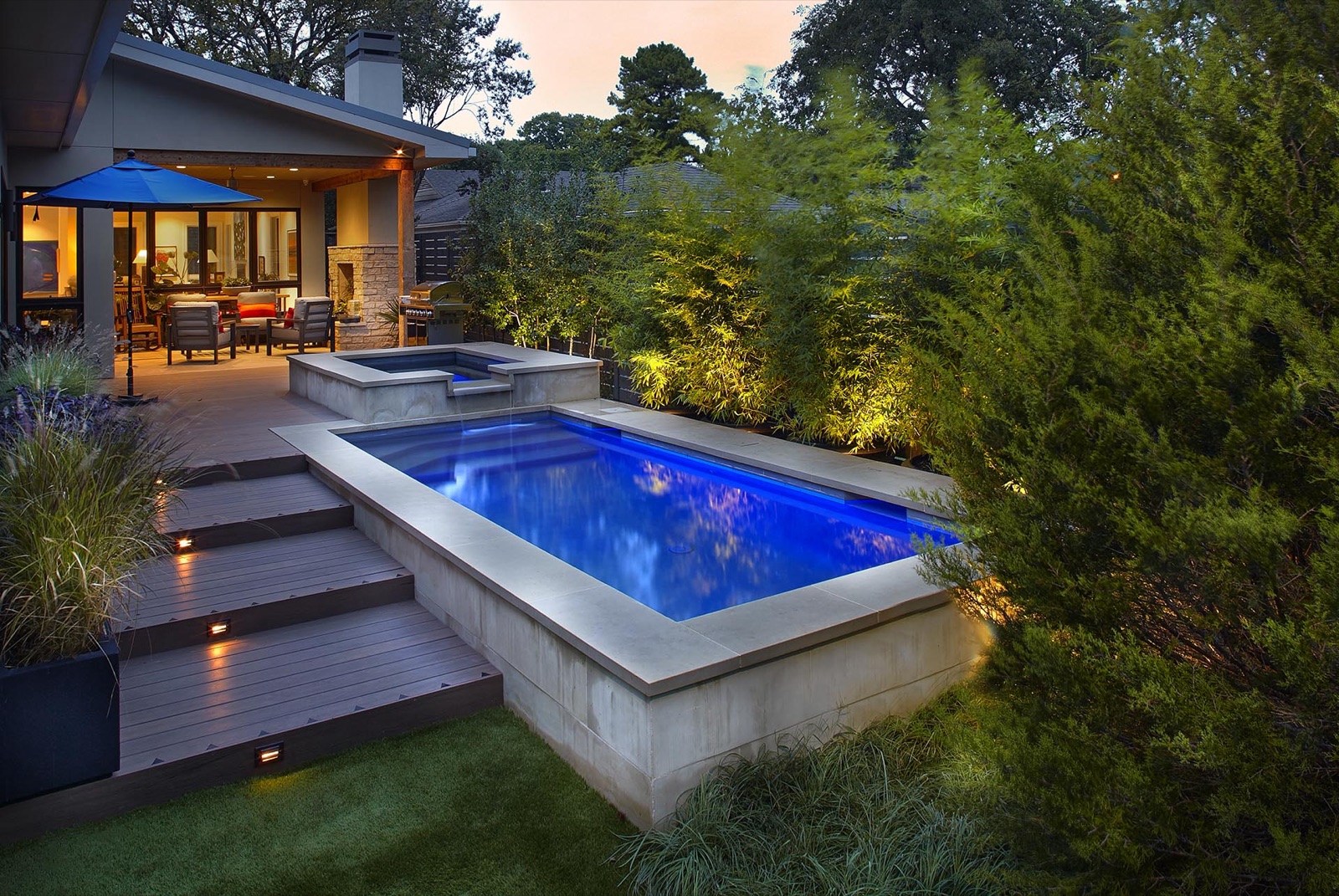 Zero lot line modern pool design for urban Dallas home by landscape design firm