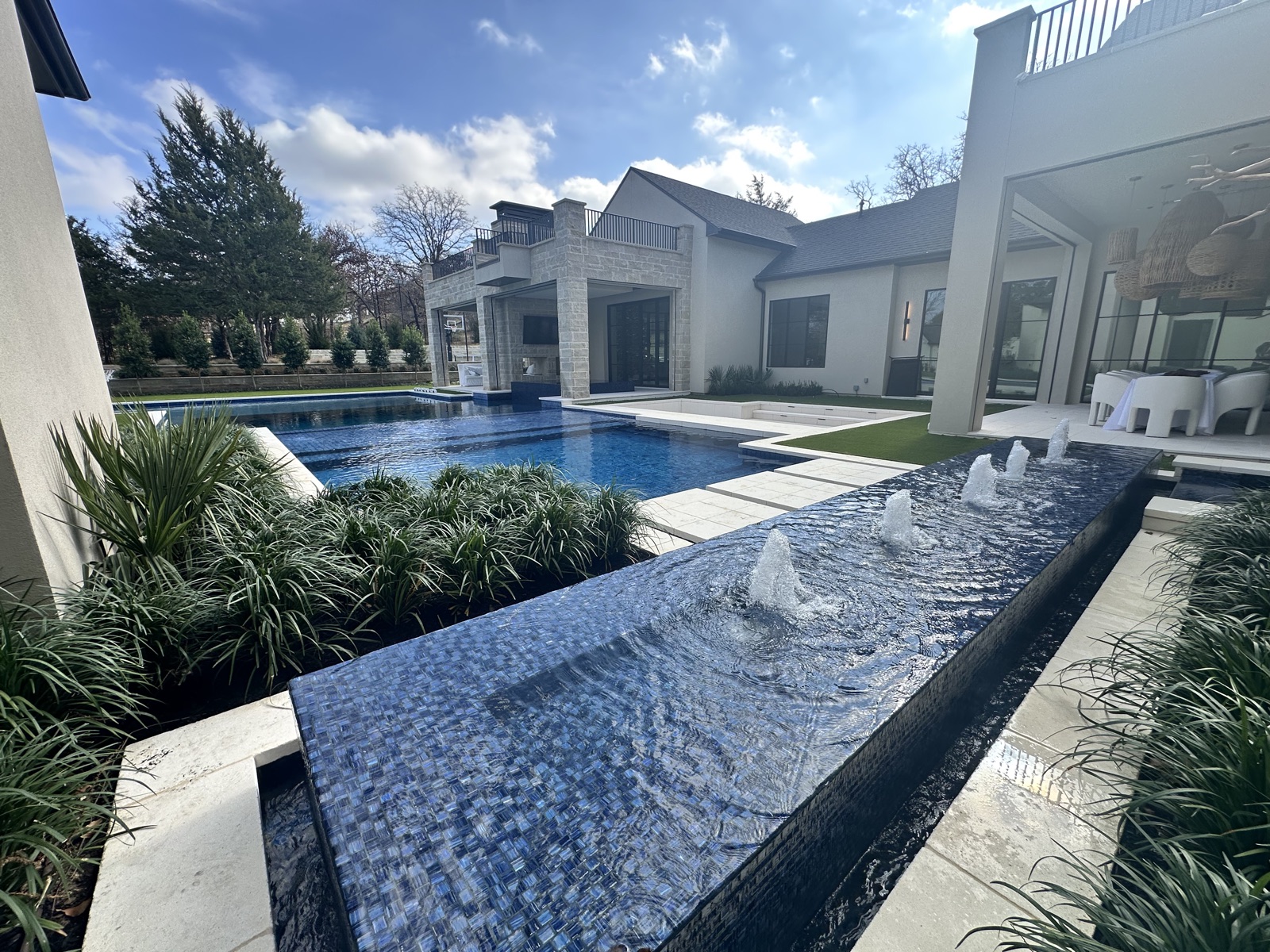 Modern estate pool landscape design in Keller Texas by Dallas landscape design firm